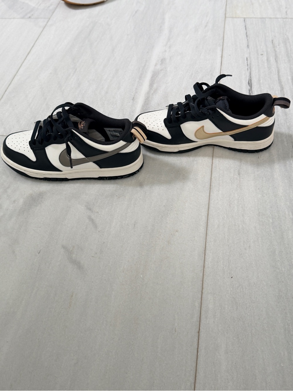 Nike Low Top Sneakers in Black, White, and Metallic Gold